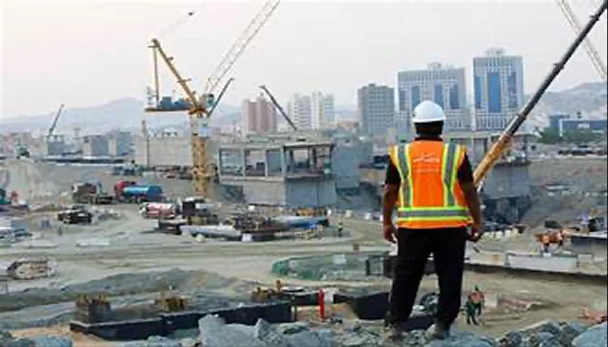 Construction site with a city skyline in the background