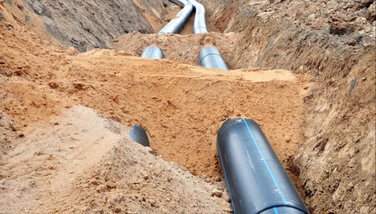 Pipelines extending through a desert trench
