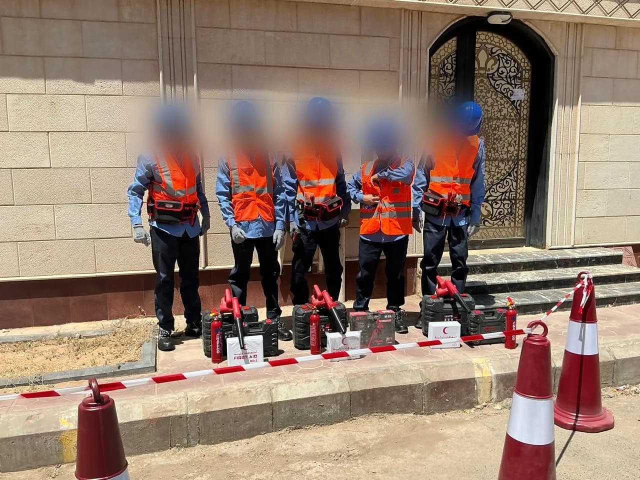 Crew with field tool kits laid out on site